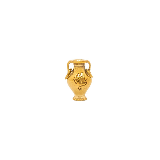 Gold urn-shaped pendant on a white background