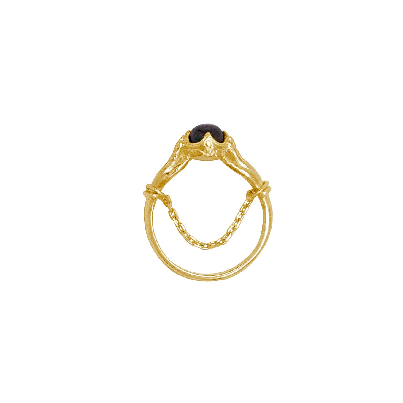Gold ring with a red gemstone on a white background