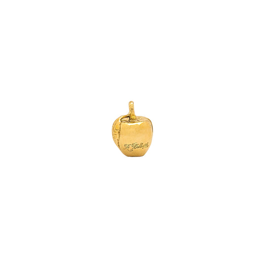 Gold apple-shaped pendant on a white background