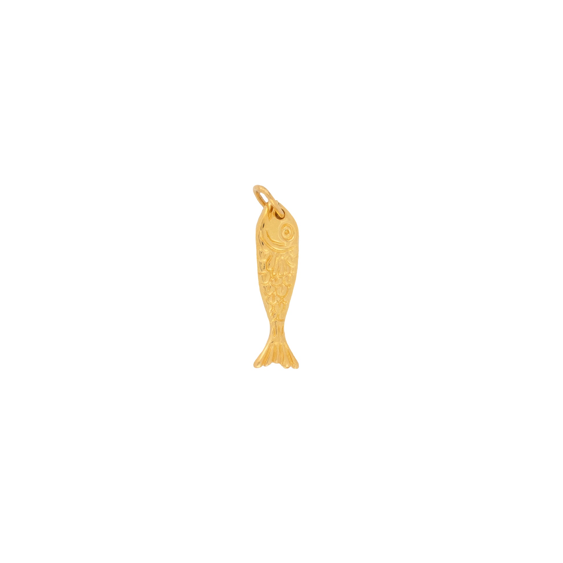 A gold charm in the shape of a fish