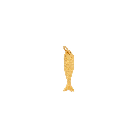 A gold charm in the shape of a fish
