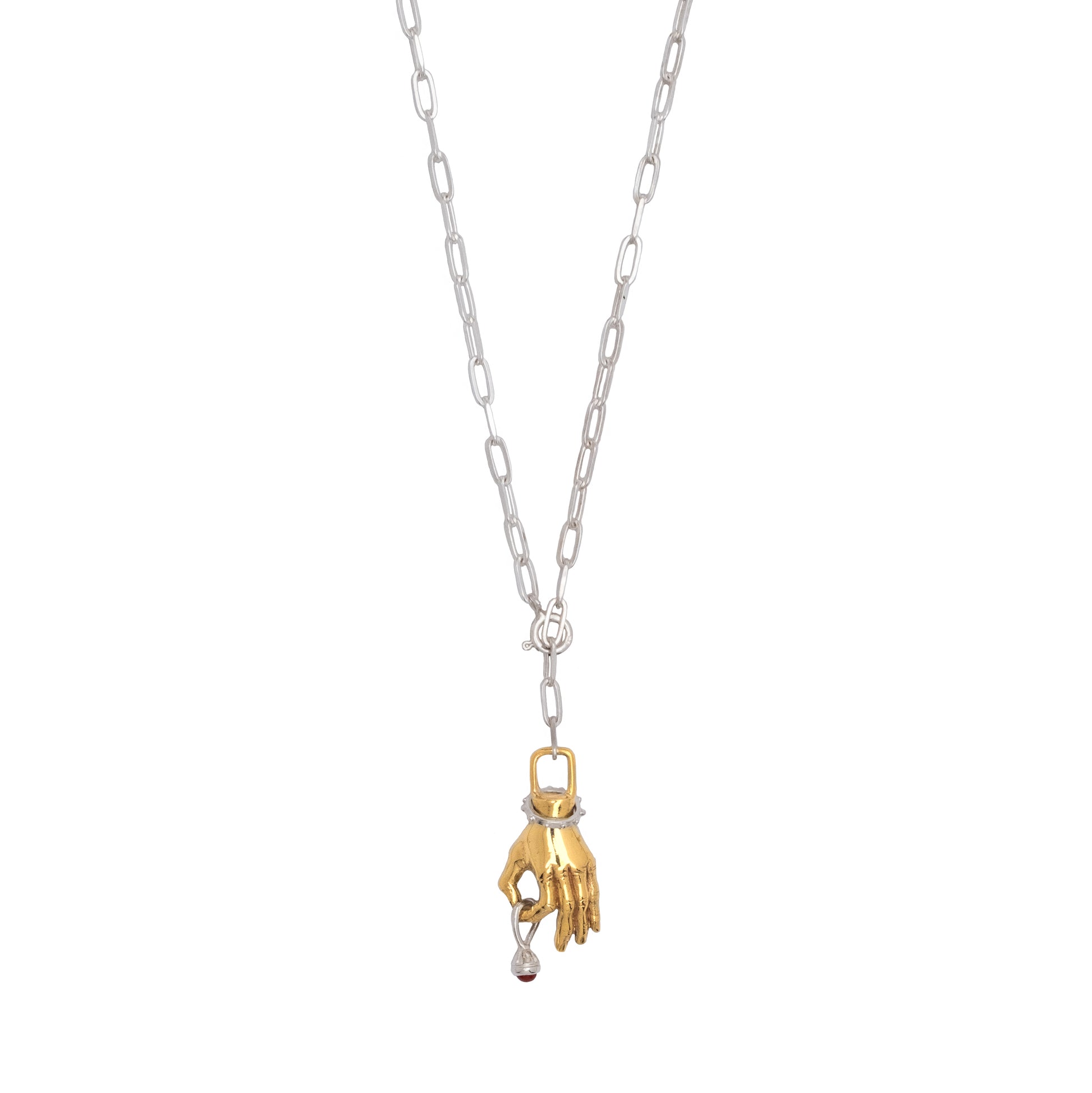 Silver necklace with a gold hand pendant holding a small silver charm
